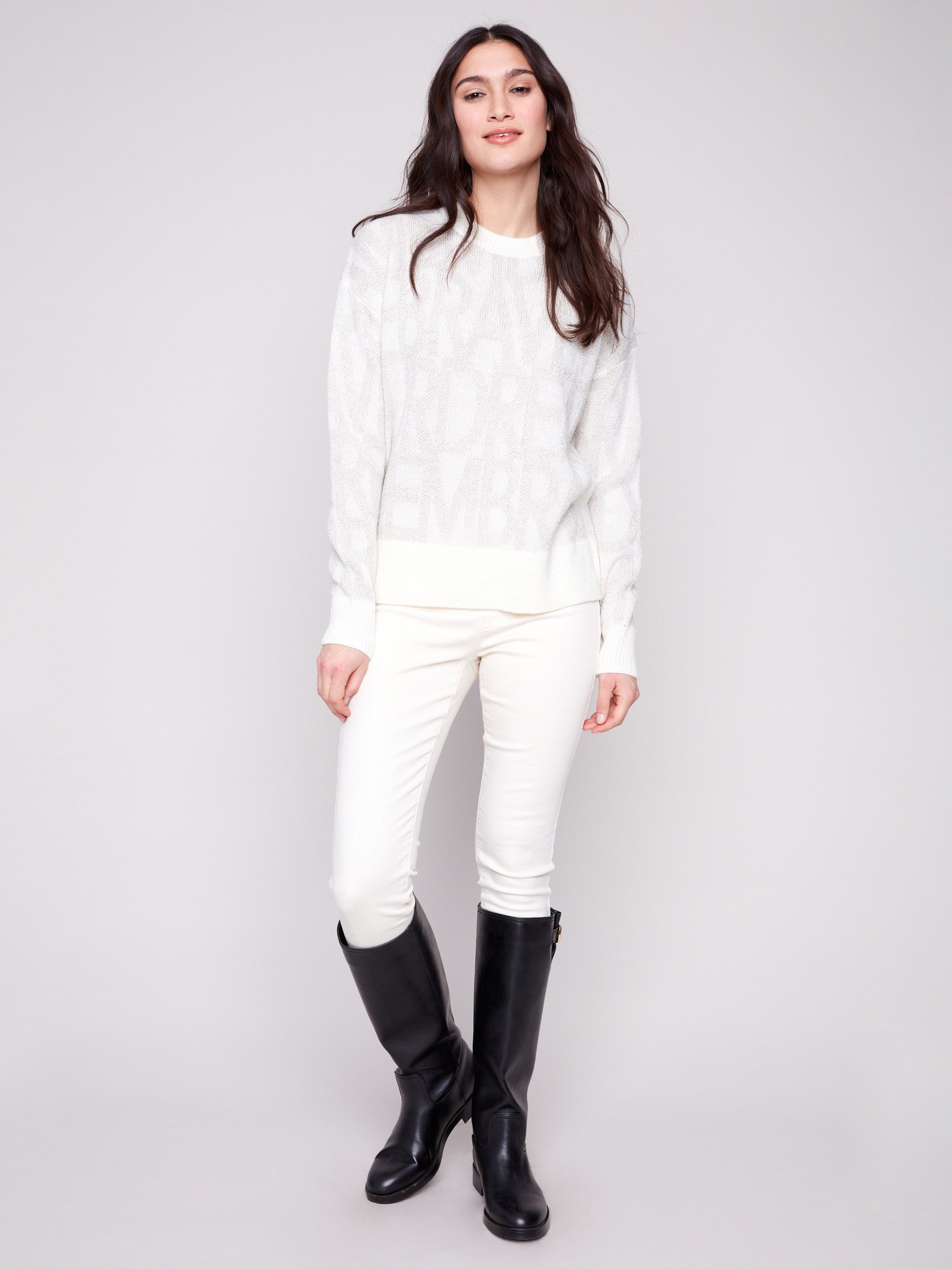 Elegant off-white sweater featuring subtle tonal text pattern for a sophisticated touch by Charlie B.