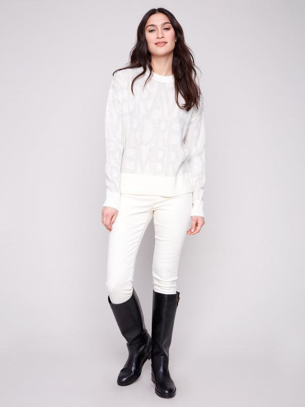 Elegant off-white sweater featuring subtle tonal text pattern for a sophisticated touch by Charlie B.