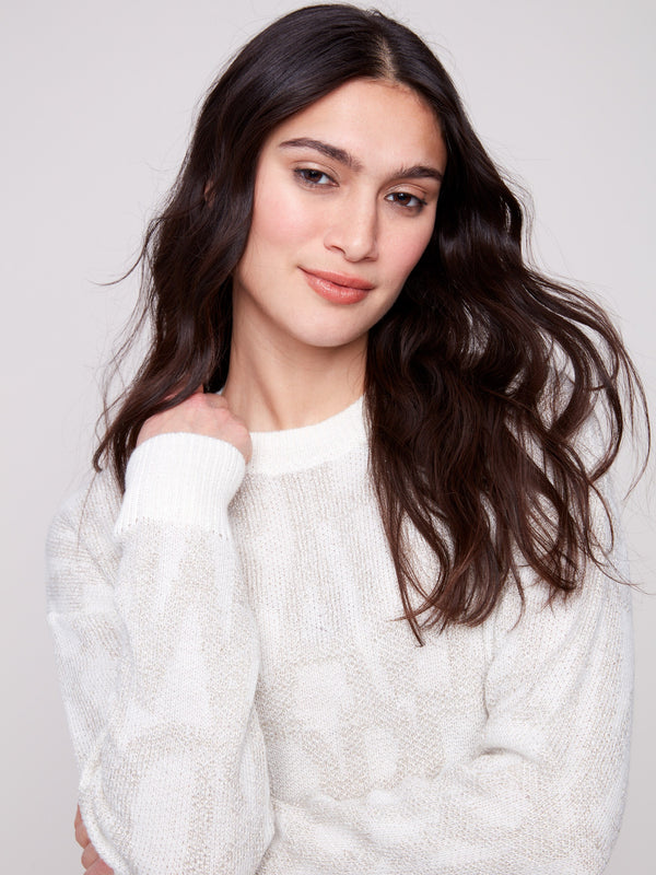 Chic jacquard sweater in off-white with ribbed cuffs, offering comfort and style by Charlie B.
