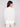 Stylish off-white sweater showcasing subtle tonal text and ribbed detailing for added elegance by Charlie B.
