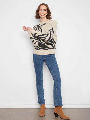 The ribbed cuffs and hem enhance the fit of this sweater, providing both comfort and style. By Charlie B.
