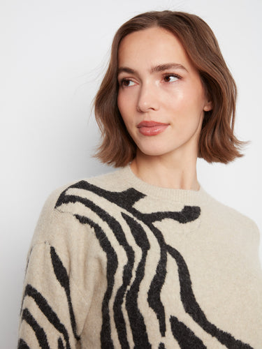 Crafted with attention to detail, the crew neck offers simplicity while maintaining elegance in this piece. By Charlie B.