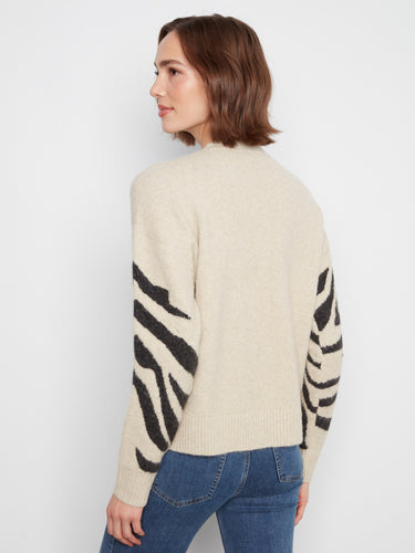 Ribbed cuffs and hem ensure durability and style in this cozy yet fashionable sweater choice. By Charlie B.