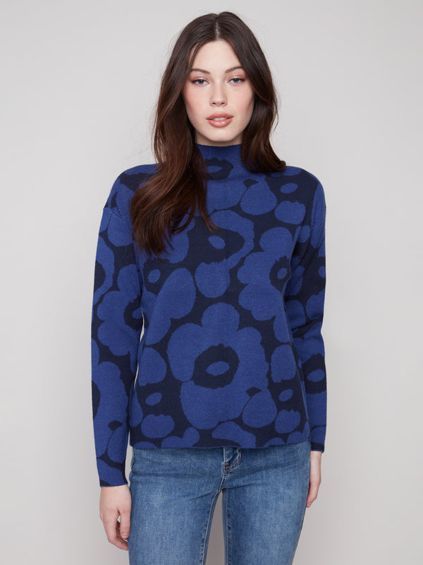 Blue aura floral-patterned jacquard sweater featuring a stylish mock neck design by Charlie B.