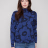 Blue aura floral-patterned jacquard sweater featuring a stylish mock neck design by Charlie B.