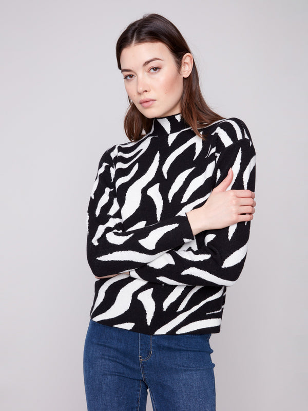 Chic mock neck zebra-patterned sweater in black and white, designed for comfort and style by Charlie B.