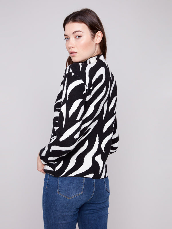 Long sleeve black and white zebra pattern sweater crafted in soft jacquard fabric for ultimate comfort by Charlie B.
