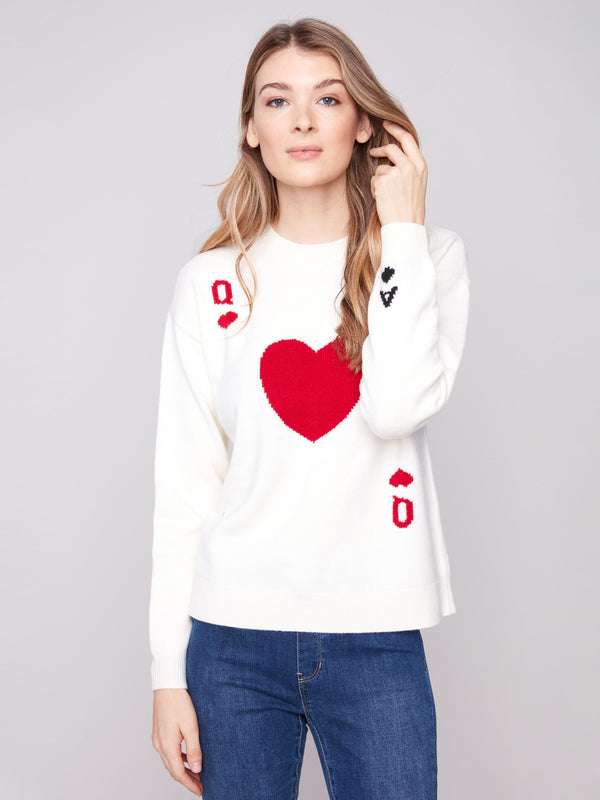 White plush knit sweater with a crew neck and Queen of Hearts design, featuring bold red graphics by Charlie B.