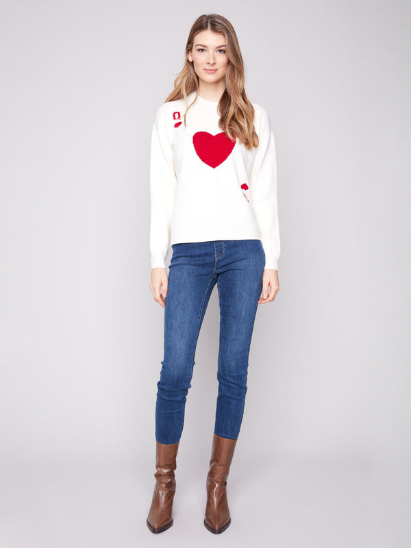 Plush knit sweater with drop shoulders and a striking Queen of Hearts card pattern, designed by Charlie B.