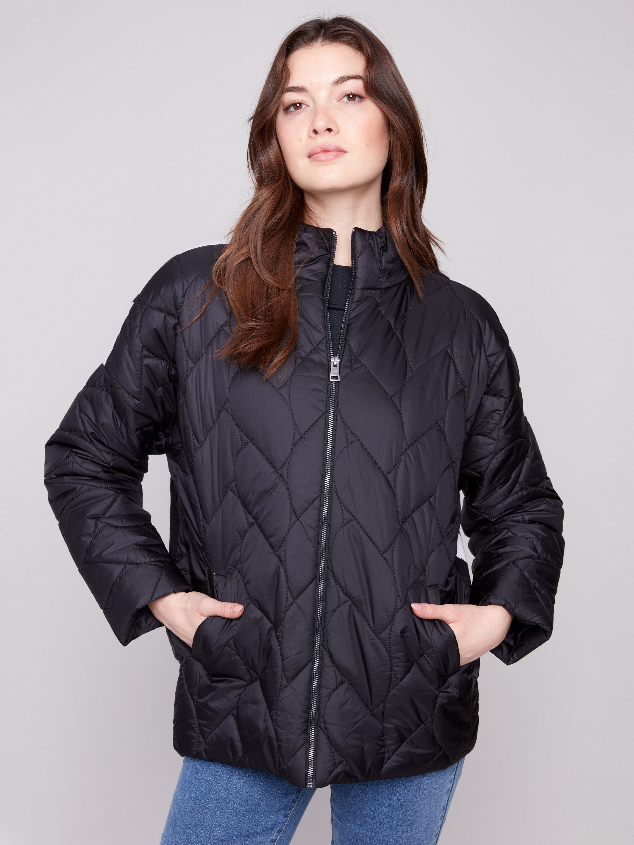 Black puffer jacket featuring a stylish drop shoulder design, perfect for a chic and relaxed look by Charlie B.