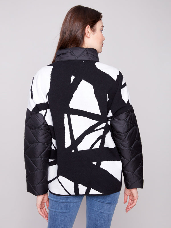 Elegant black quilted jacket with unique jacquard knit pattern on the back, adding a touch of sophistication by Charlie B.