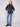 Stylish black jacket showcasing practical welt pockets, ideal for keeping essentials close by Charlie B.