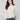 Elegant ecru sweater with a relaxed fit, showcasing a geometric jacquard pattern and stylish folded cuffs by Charlie B.