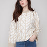 Elegant ecru sweater with a relaxed fit, showcasing a geometric jacquard pattern and stylish folded cuffs by Charlie B.