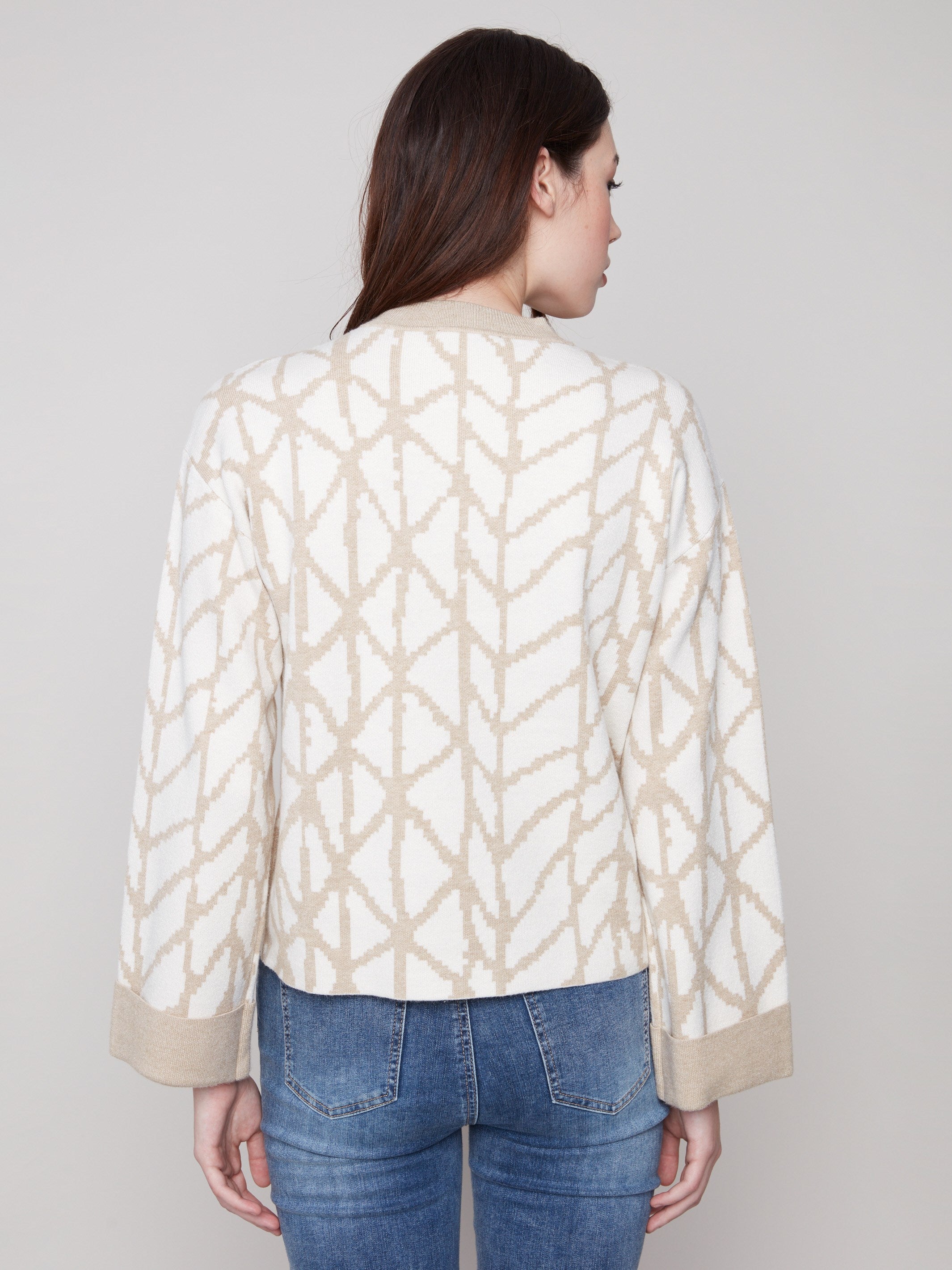 Stylish ecru sweater in jacquard pattern, highlighting its relaxed fit and classic crew neckline by Charlie B.