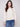 Ecru jacquard sweater featuring a cozy crew neckline and elegant folded cuffs for a refined look by Charlie B.