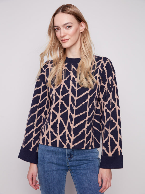 Navy blue sweater with a geometric jacquard pattern, showcasing a relaxed fit for comfortable wear by Charlie B.