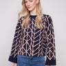 Navy blue sweater with a geometric jacquard pattern, showcasing a relaxed fit for comfortable wear by Charlie B.