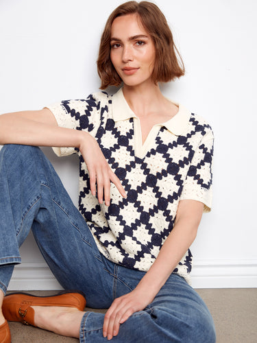 Elegant crochet top in navy and cream, highlighted by its intricate geometric pattern by Charlie B.