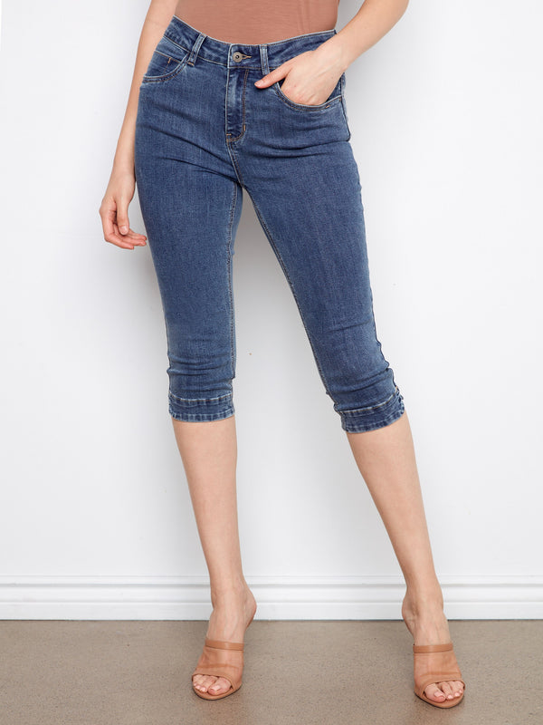 Chic blue capri jeans in a slim fit with stretch denim, offering both style and flexibility by Charlie B.