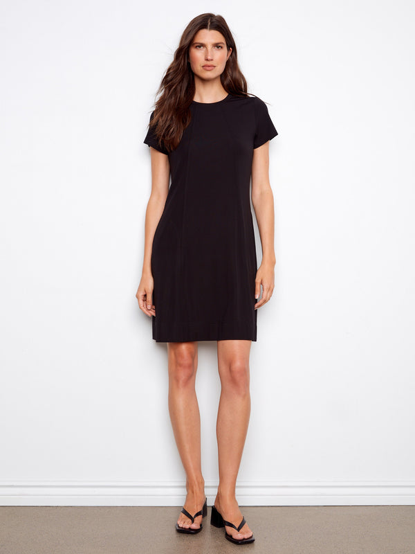 Elegant black dress with a crew neckline and short sleeves, featuring knee-length design by Charlie B.