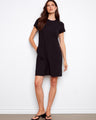 Chic black dress showcasing convenient side pockets and a sleek silhouette by Charlie B.