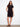 Chic black dress showcasing convenient side pockets and a sleek silhouette by Charlie B.