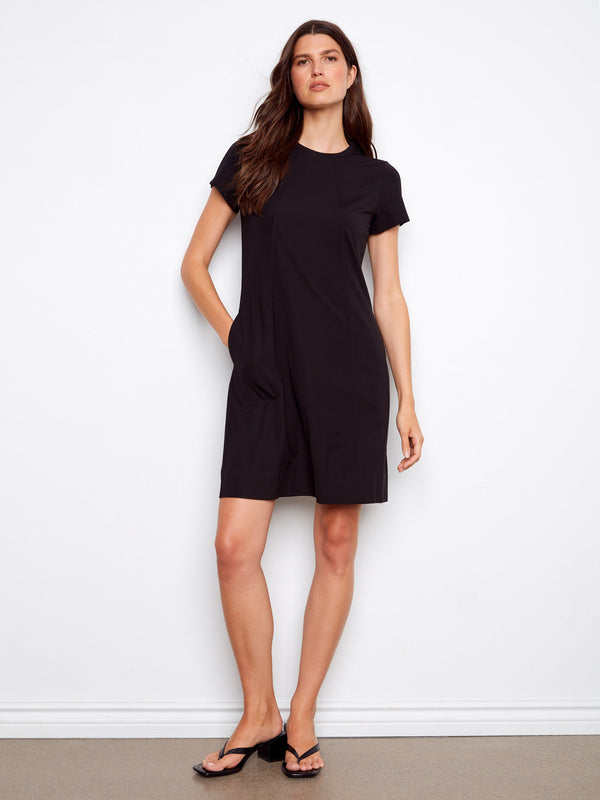 Chic black dress showcasing convenient side pockets and a sleek silhouette by Charlie B.