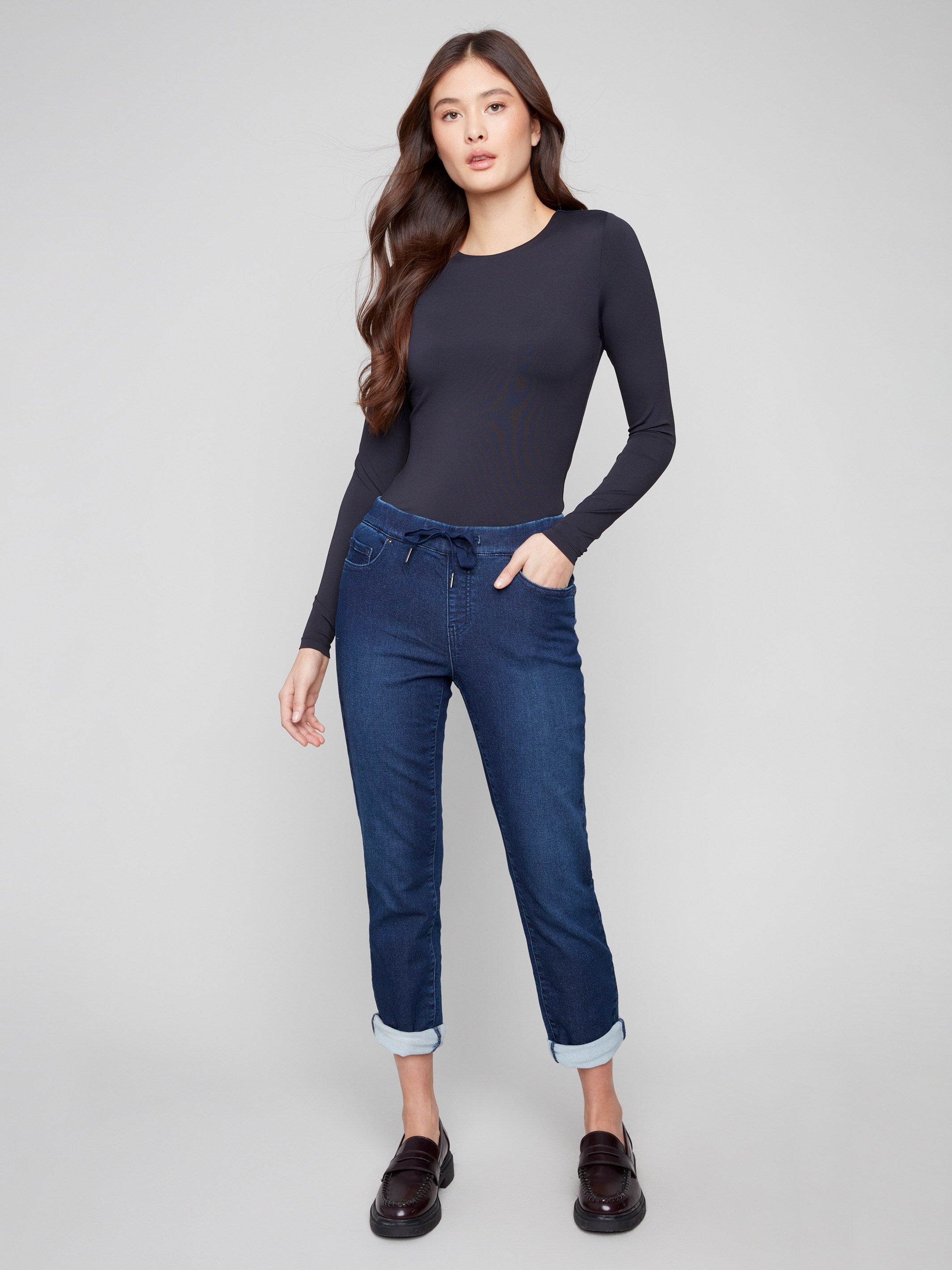Denim jogger pants featuring a slim leg and rolled cuffs, perfect for a casual day out by Charlie B.