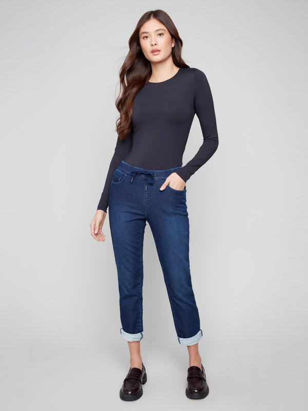 Denim jogger pants featuring a slim leg and rolled cuffs, perfect for a casual day out by Charlie B.