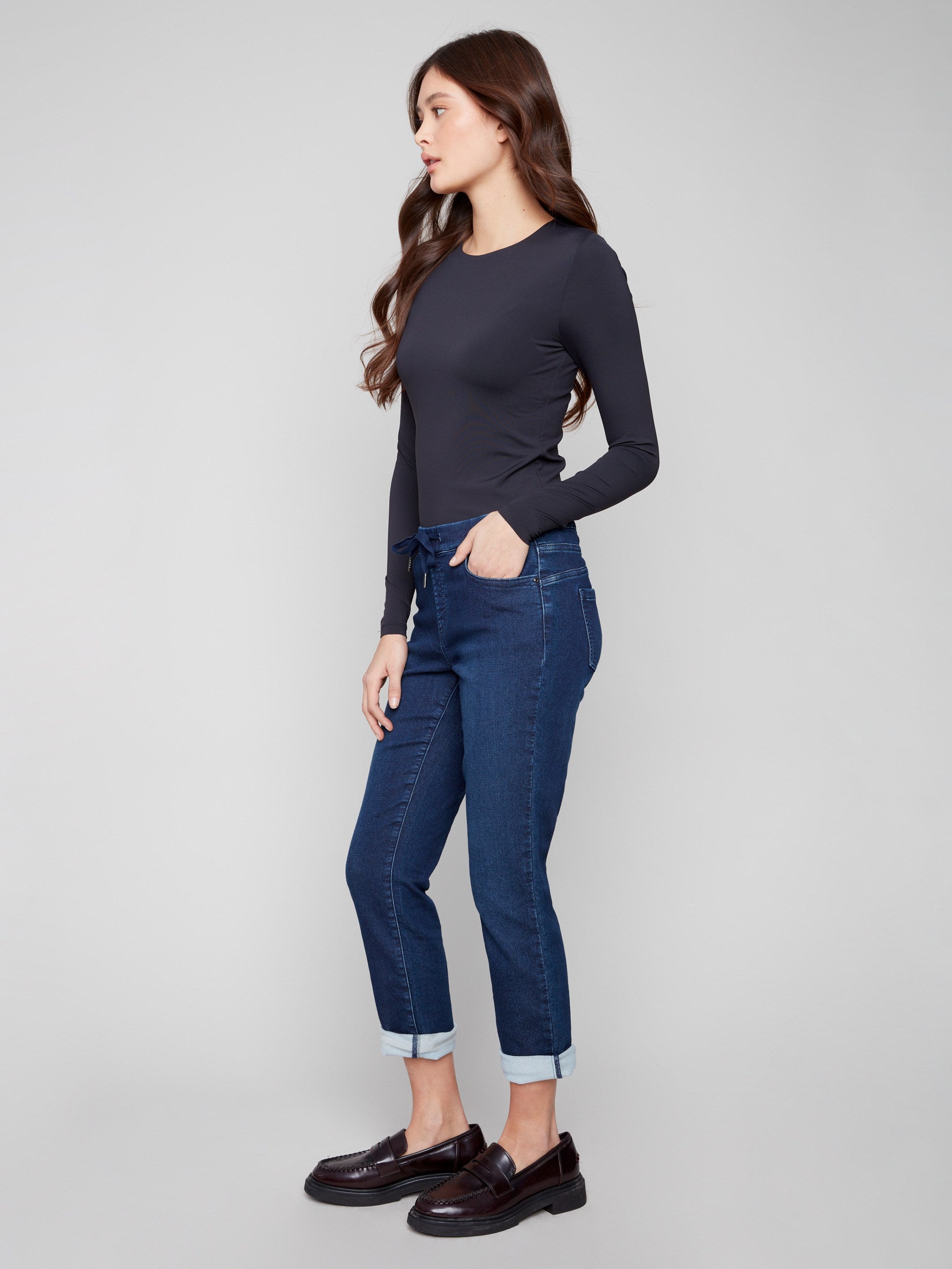 Stylish denim pants with a five-pocket design and rolled cuffs, ideal for versatile wear by Charlie B.