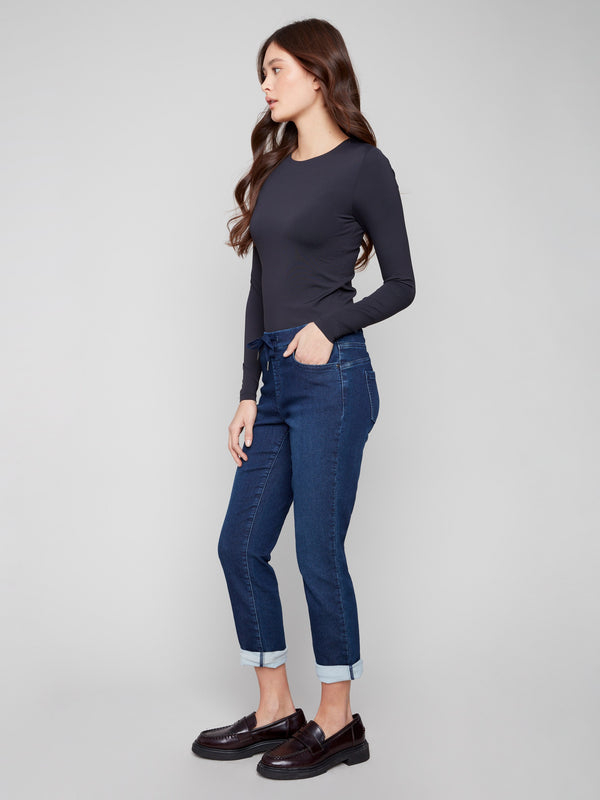 Stylish denim pants with a five-pocket design and rolled cuffs, ideal for versatile wear by Charlie B.