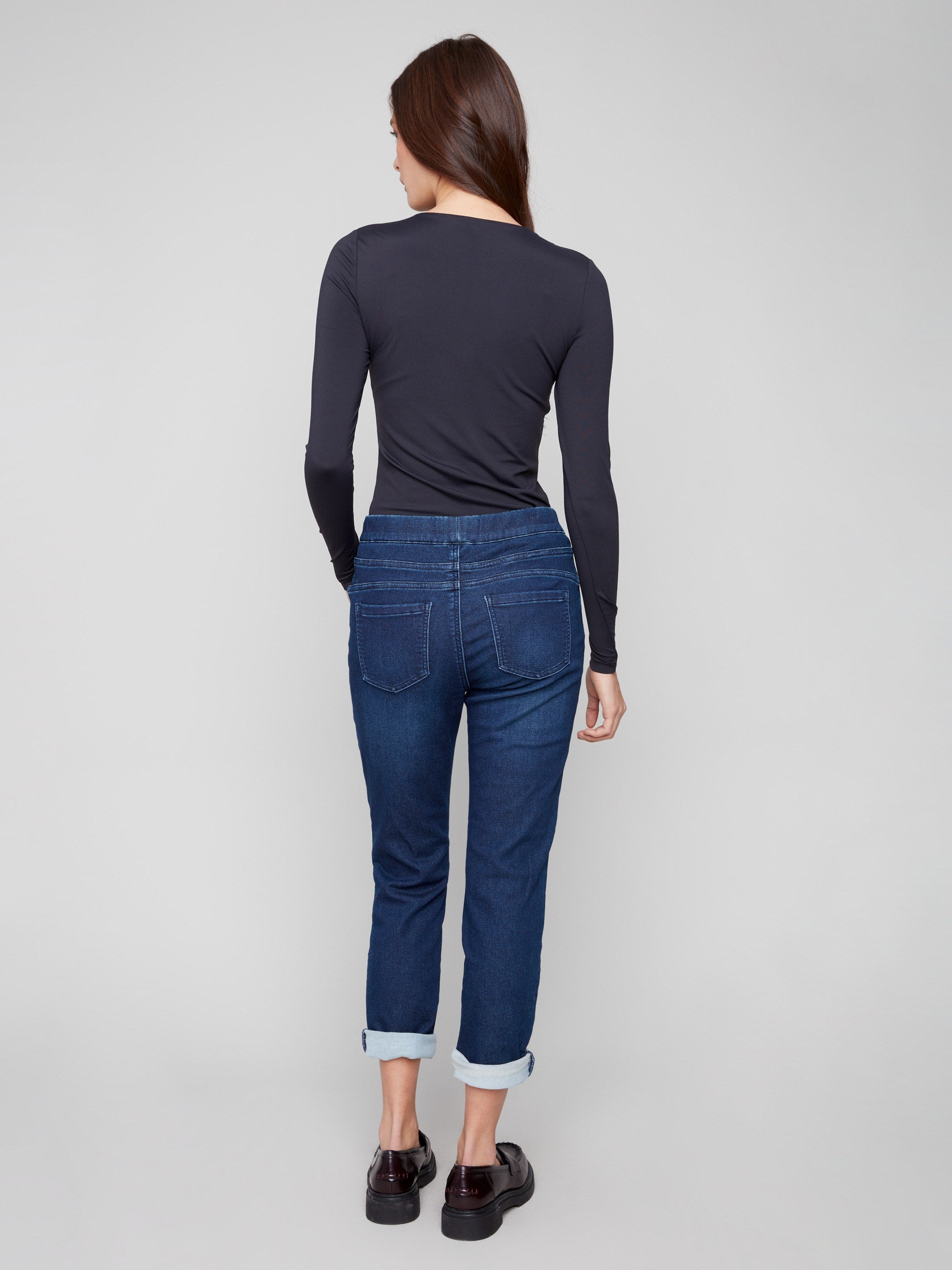 Indigo denim joggers showcasing back pockets and rolled cuffs, combining style with practicality by Charlie B.