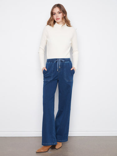 These wide leg pants offer a relaxed fit, perfect for any casual outing. Crafted in stretch knit denim by Charlie B.