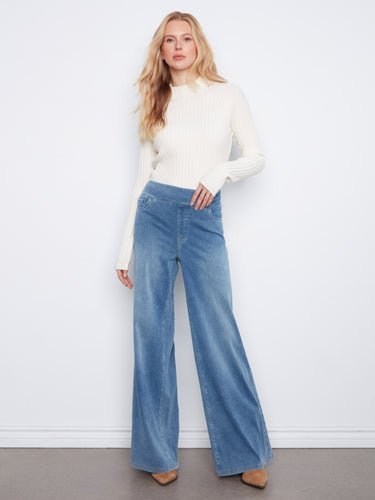 Medium blue full-length wide-leg jeans designed with stretchy knit denim for an effortlessly chic look by Charlie B.