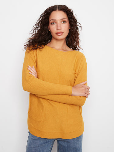 Trendy sweater with convenient front pockets to keep essentials handy while on the go. Designed by Charlie B.