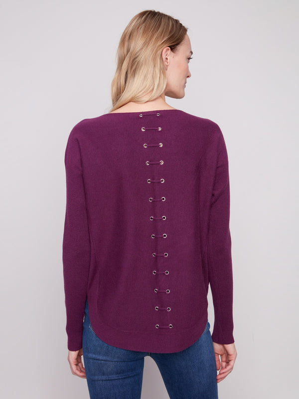 Stylish berry knit sweater showcasing intricate back lace-up eyelet details by Charlie B.