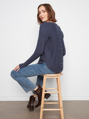 Elegant knit sweater featuring back lace-up eyelet details, adding a unique touch to your look by Charlie B.