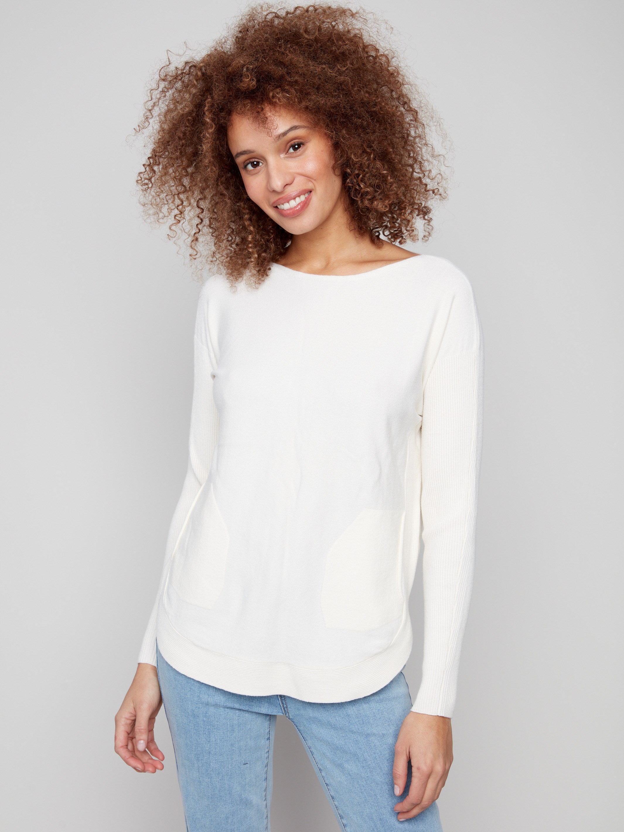 Ecru knit sweater featuring a stylish boat neck and round hem, perfect for any occasion by Charlie B.