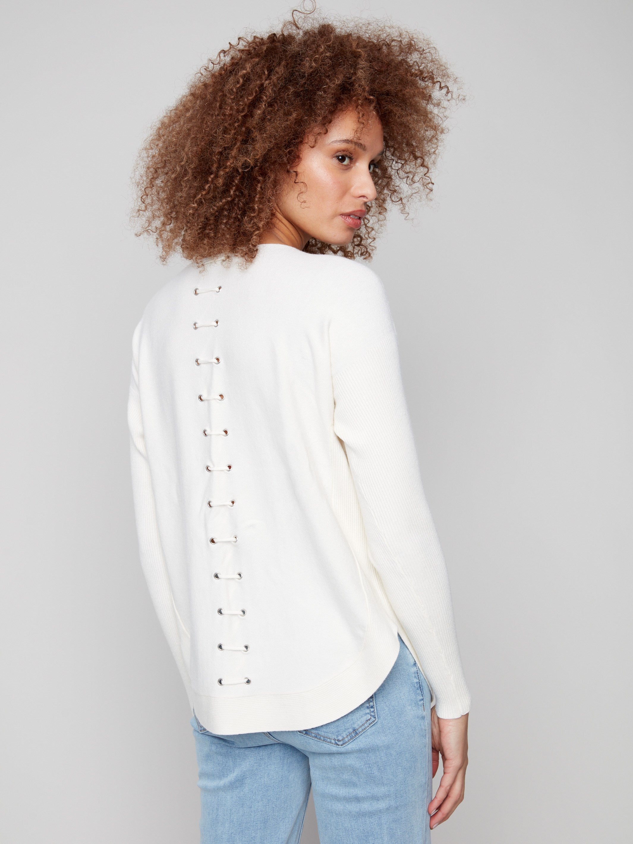 Chic ecru sweater with elegant back lace-up eyelet details adding a unique touch by Charlie B.