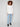 Cozy ecru knit with long ribbed sleeves and rounded hem, ideal for layering in cooler weather by Charlie B.