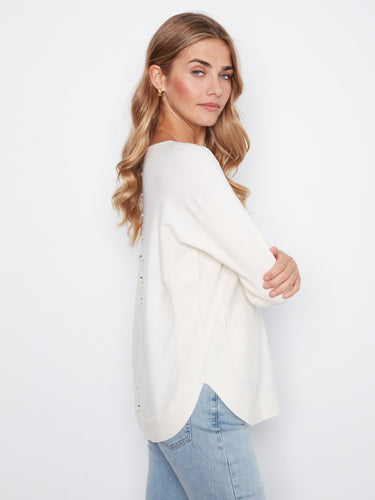 The rounded hem design gives this sweater a modern touch, offering both comfort and style in one piece. By Charlie B.