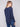 Denim knit sweater with unique back lace-up eyelet details adding flair to the design by Charlie B.