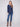 Chic denim knit sweater complete with practical front pockets for added convenience by Charlie B.
