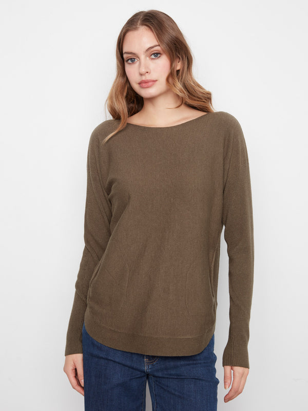 Sweater with a stylish boat neck, perfect for a chic and comfortable look. Crafted with attention to detail by Charlie B.