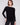 Black knit sweater featuring a stylish boat neck and rounded hem by Charlie B.