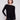 Black knit sweater featuring a stylish boat neck and rounded hem by Charlie B.