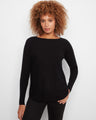 Black knit sweater featuring front pockets and a stylish boat neck, perfect for any casual outing by Charlie B.