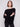 Chic black knit sweater with long ribbed sleeves, perfect for any occasion by Charlie B.