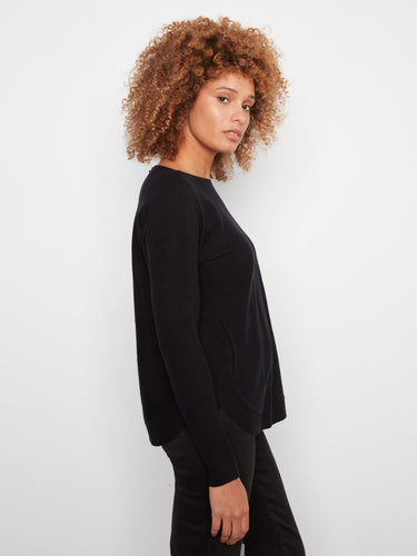 Classic black knit sweater showcasing a flattering fit and versatile design for everyday wear by Charlie B.